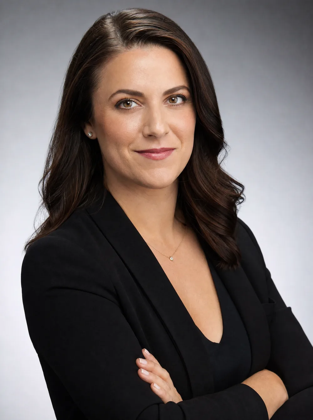 Clean professional corporate headshot on a neutral seamless background